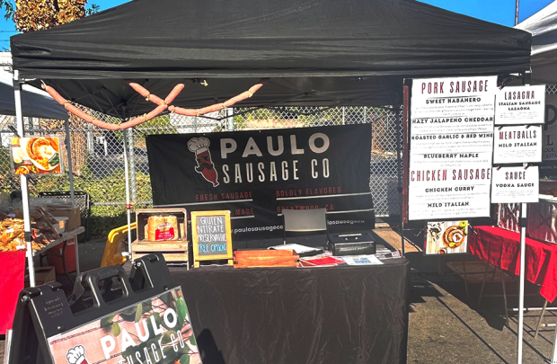 Paolo Sausage stall filled with a menu showcasing the varieties of sausage 