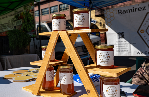 Honey on a rack at the Ramirez Apiary table