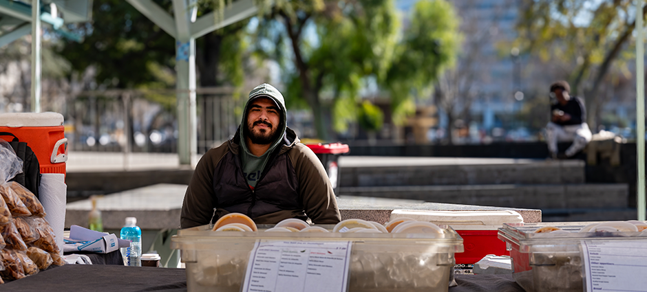 Vendor at the Hummus Heaven booth