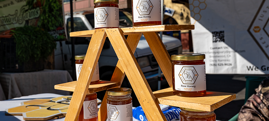 Honey on a rack at the Ramirez Apiary table